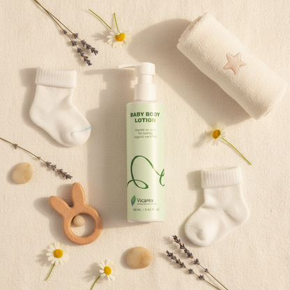 Flat lay with baby lotion and adorable baby items