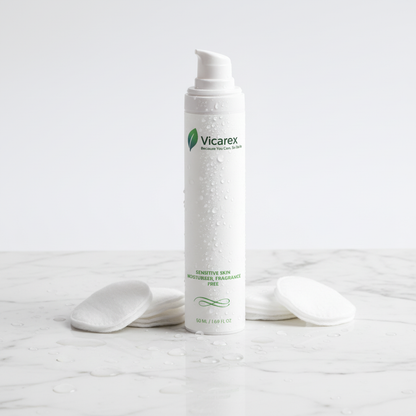 Moisturiser on marble with cotton pads